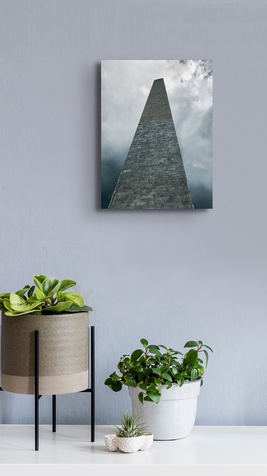 Washington Monument Canvas Wall Art in lounge room with grey wall, several pot plants and white floorboards