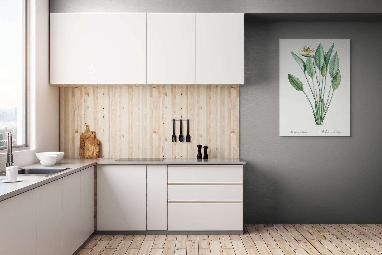a kitchen with white cabinets and a painting on the wall