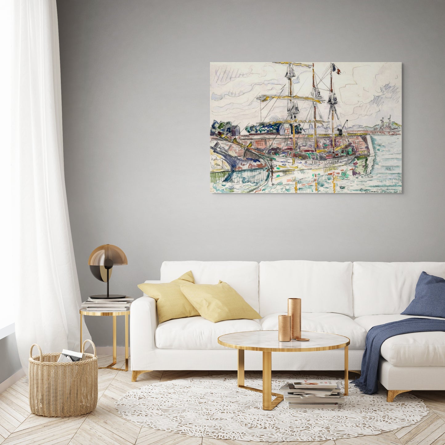 a living room with a white couch and a painting on the wall