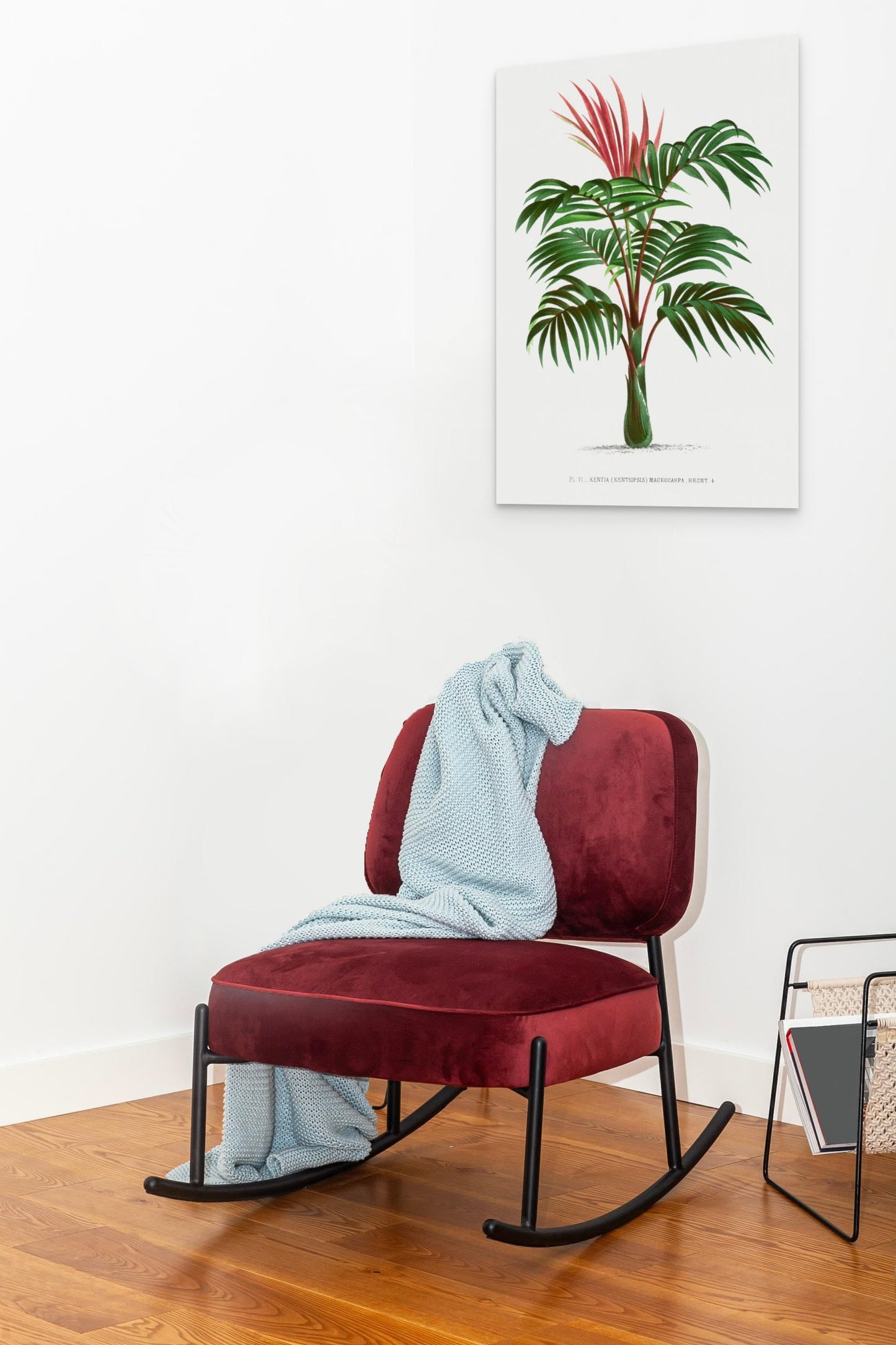 a red chair with a blanket on top of it