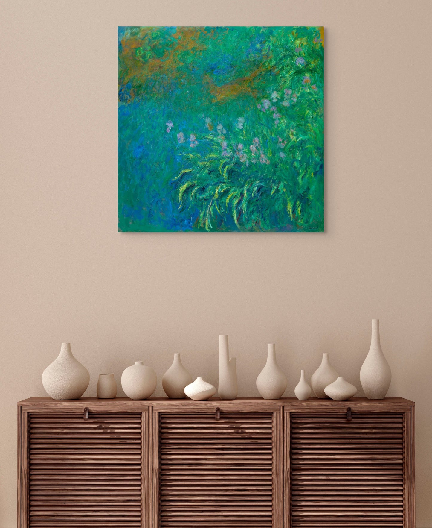 a painting on a wall above a cabinet with vases