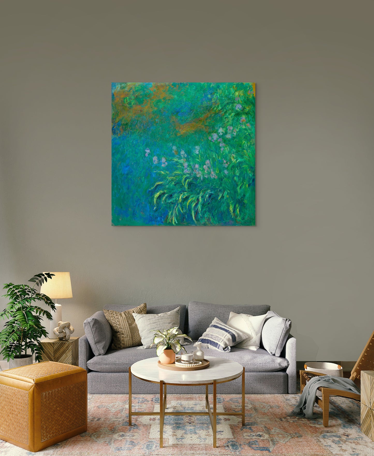 a living room filled with furniture and a painting on the wall