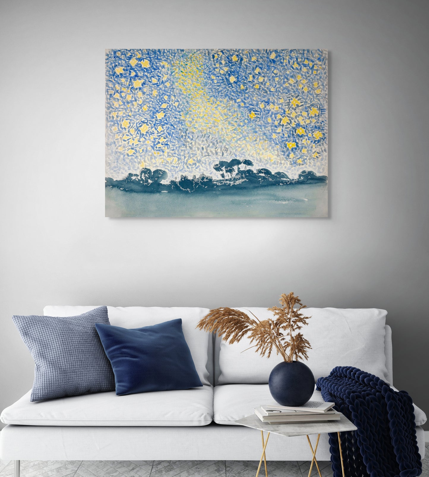 a living room with a couch and a painting on the wall