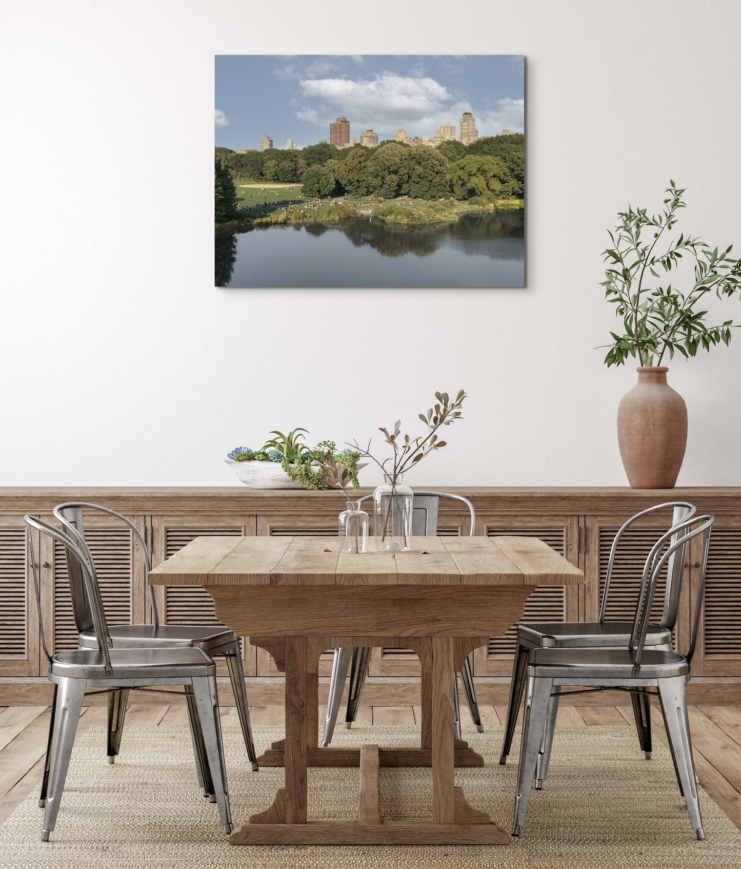 Central Park Canvas Wall Art in dining room with wooden dining table, white wall and metal chairs