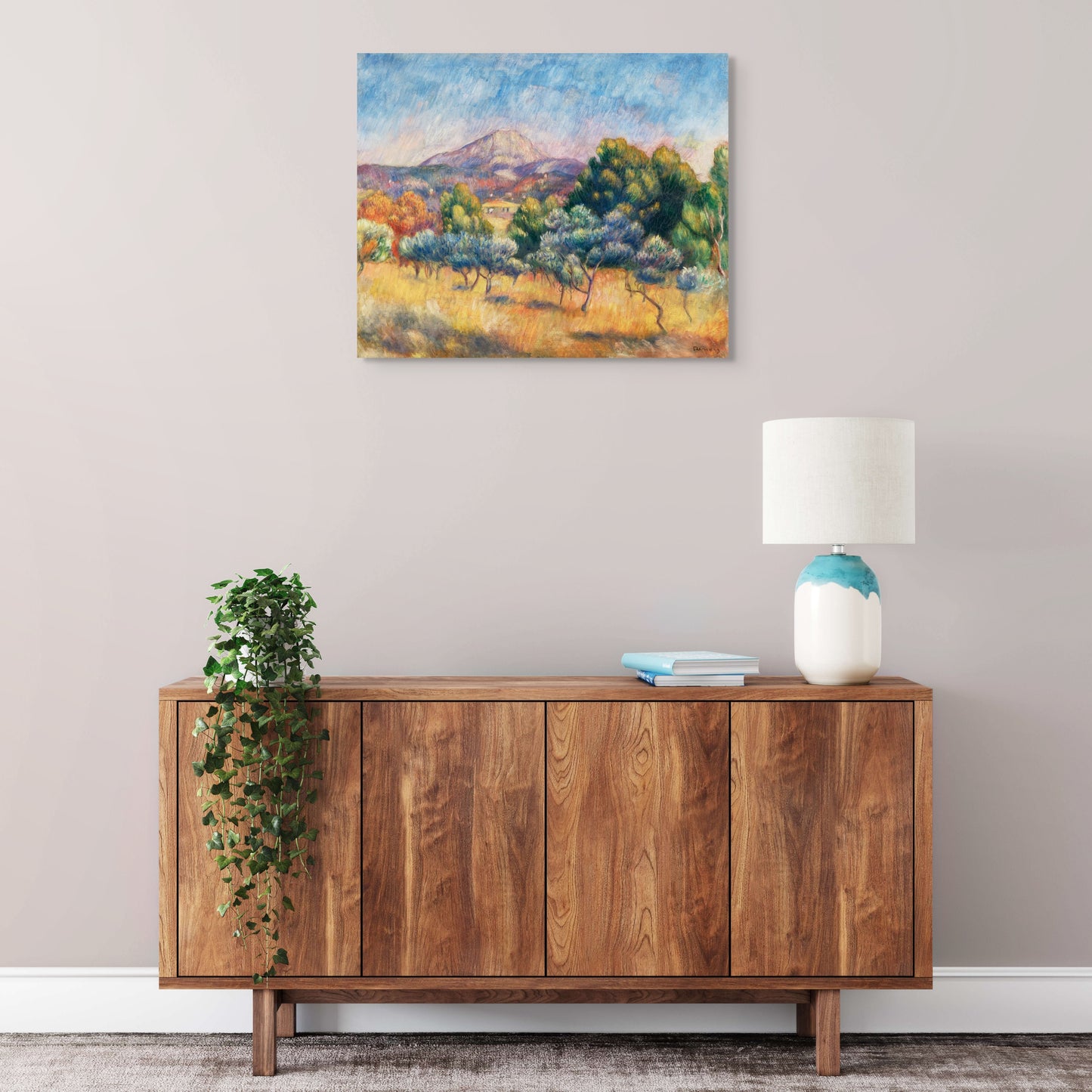 a painting on a wall above a wooden cabinet