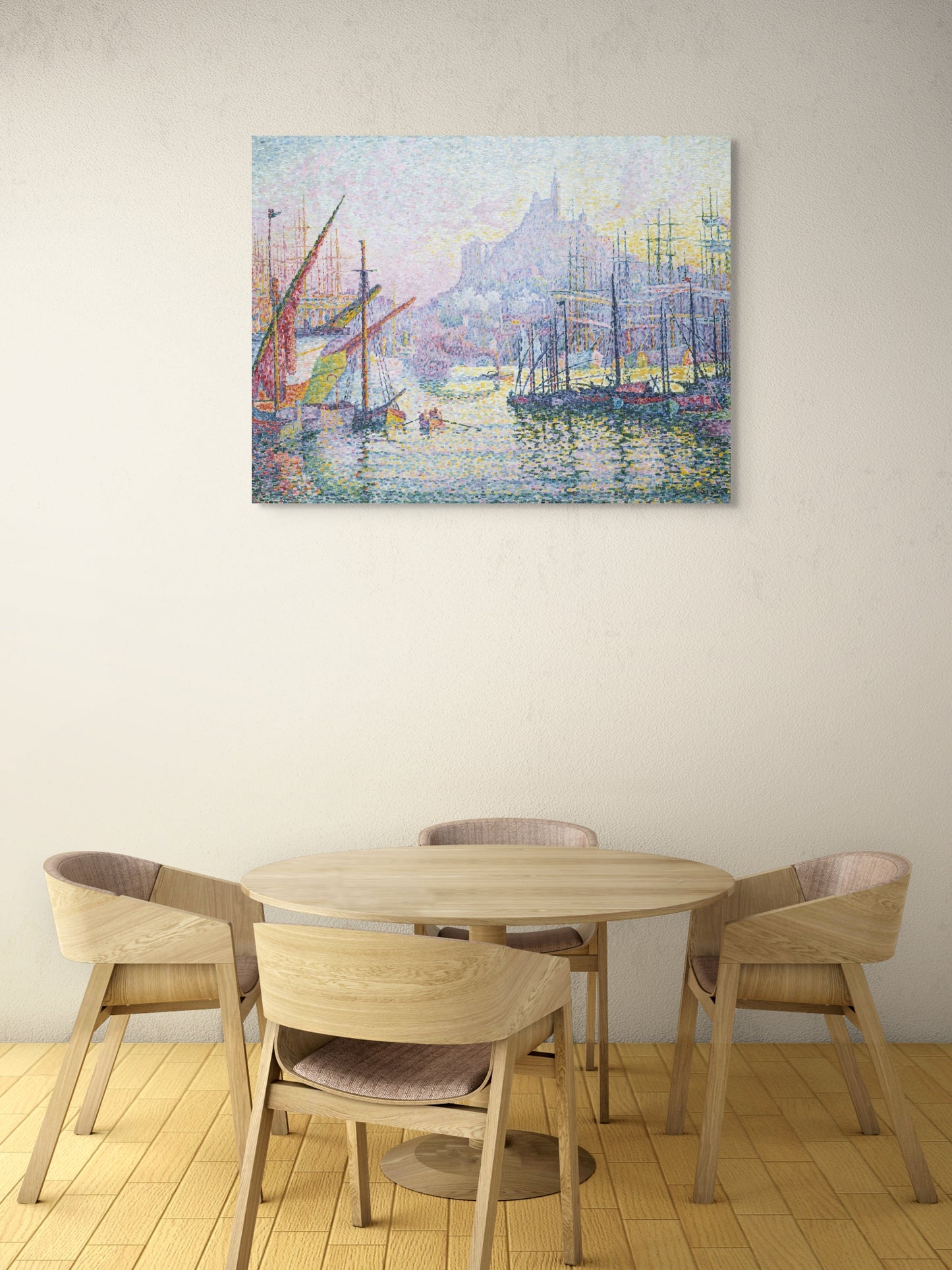 a table and chairs in a room with a painting on the wall