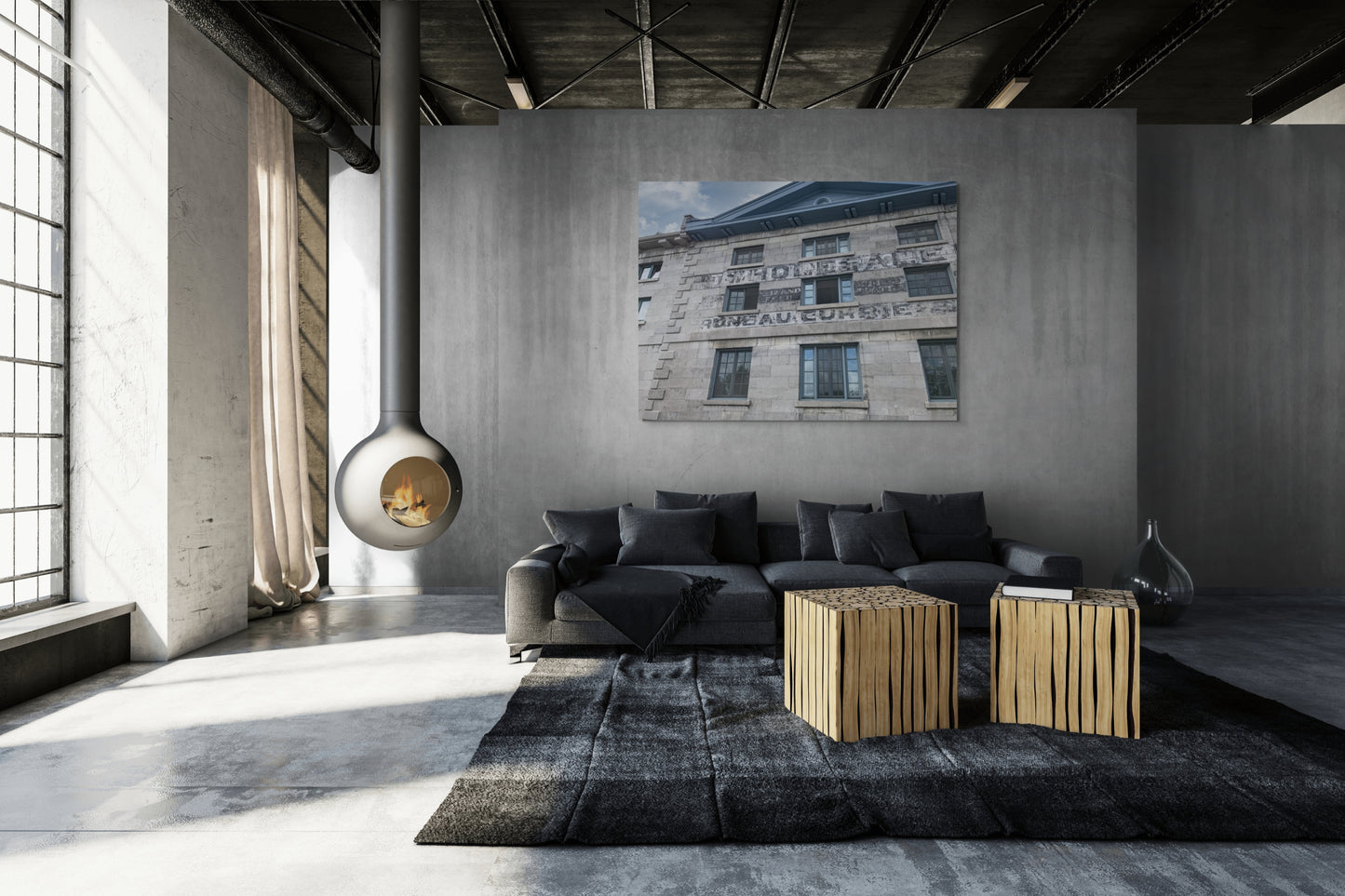 Old Warehouse Canvas Wall Art in warehouse loungeroom with grey concrete walls, exposed ceiling, fireplace, dark grey lounge, black rug, wooden side tables and polished concrete floor
