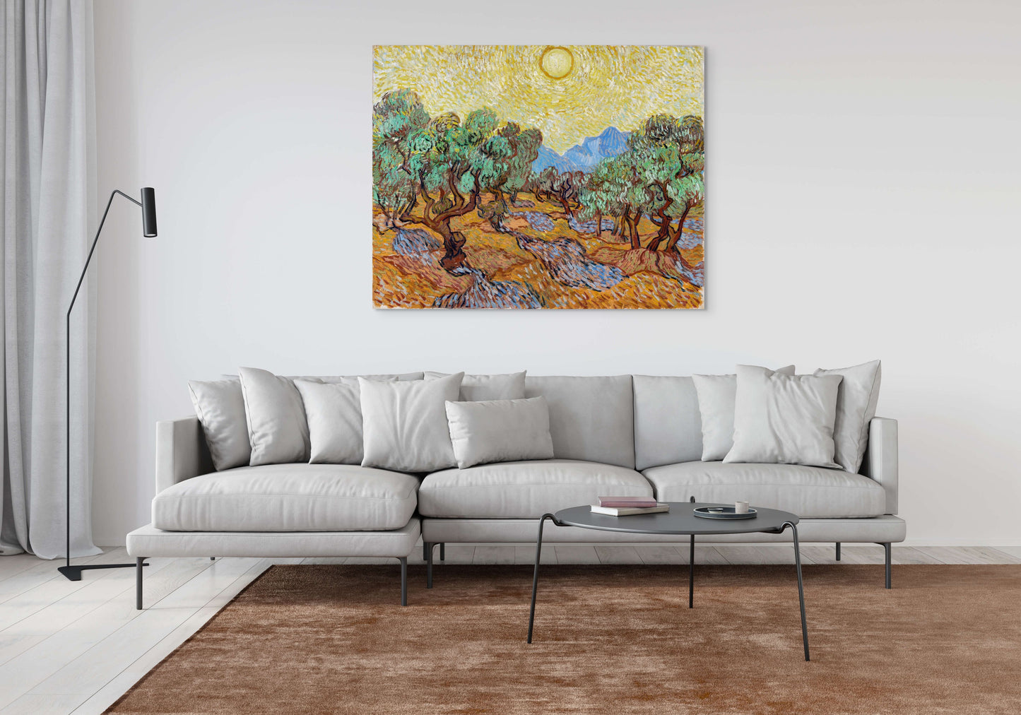 a living room with a couch and a painting on the wall