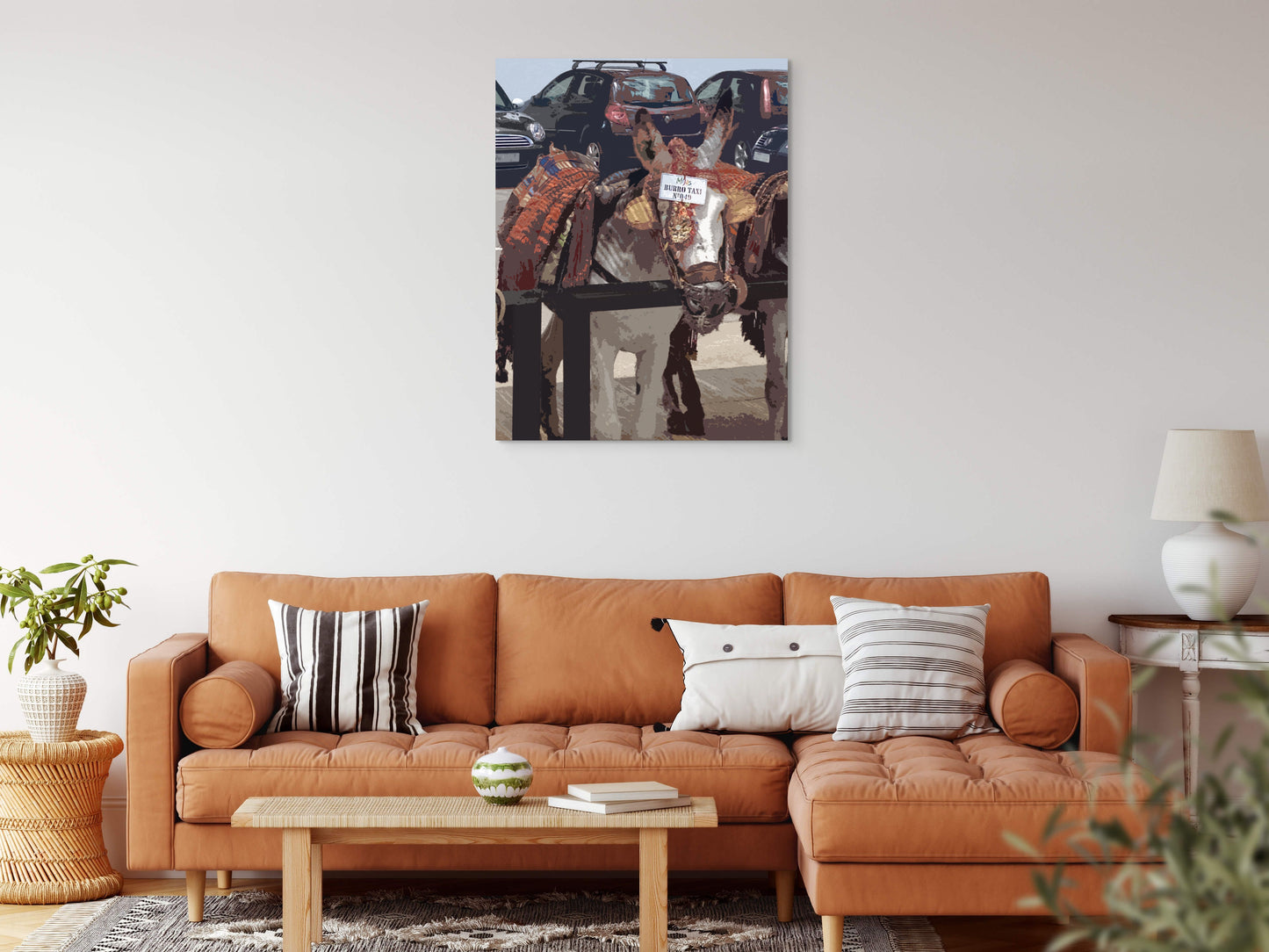 Burro Taxi Canvas Wall Art in lounge room with orange lounge and white wall