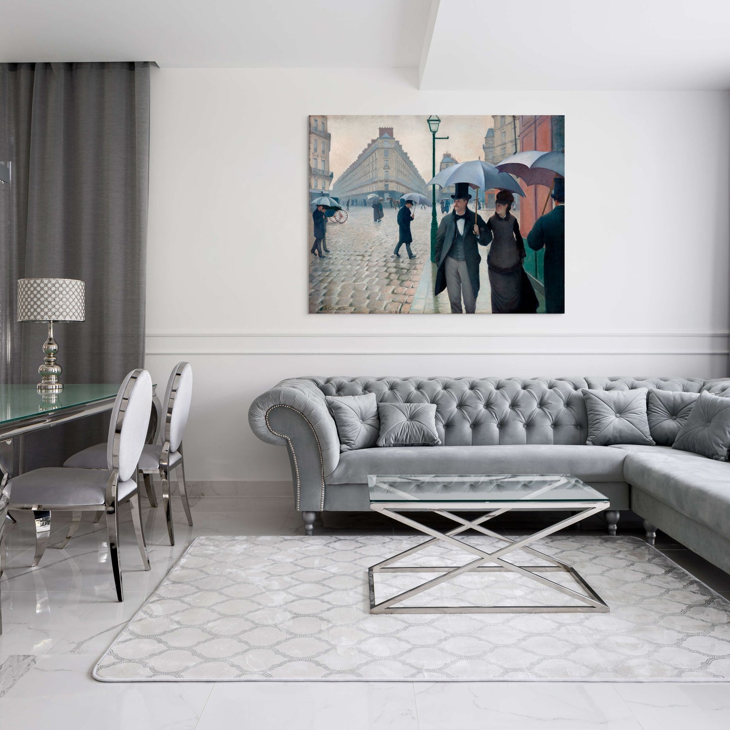 a living room filled with furniture and a painting on the wall