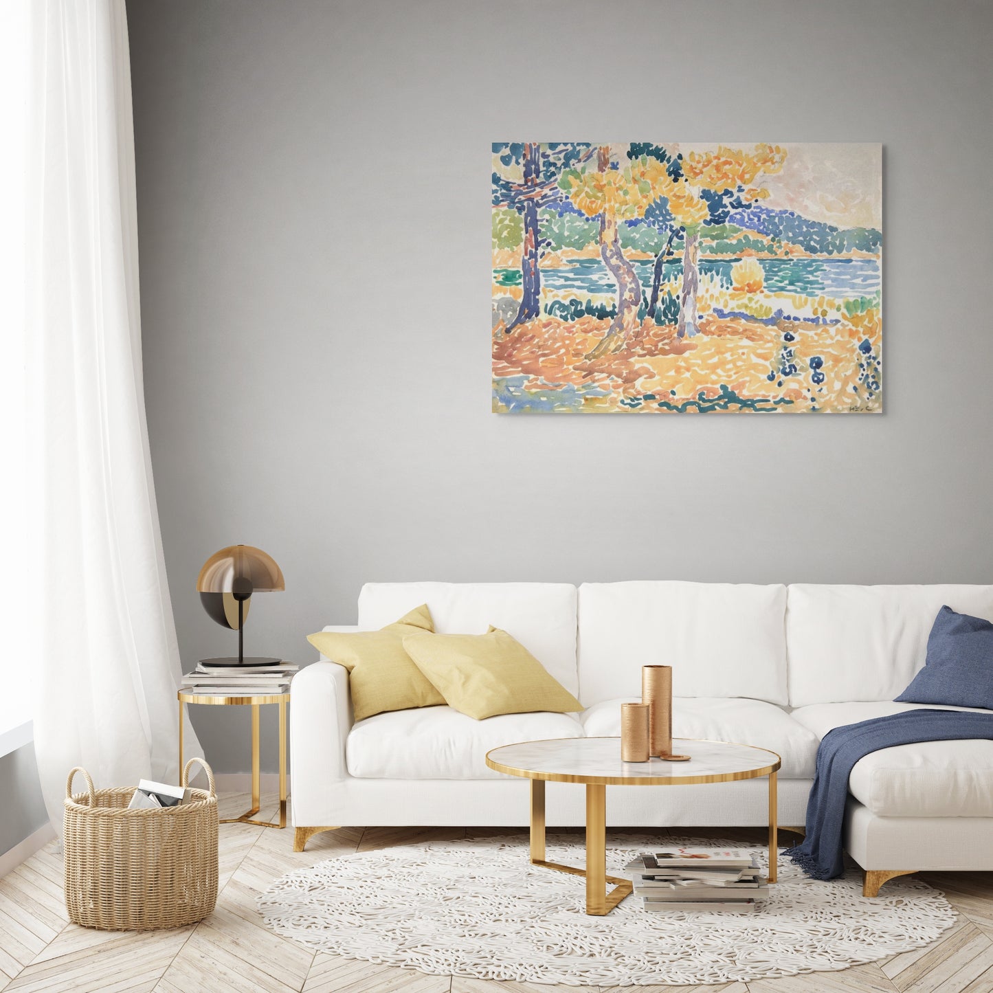 a living room with a white couch and a painting on the wall