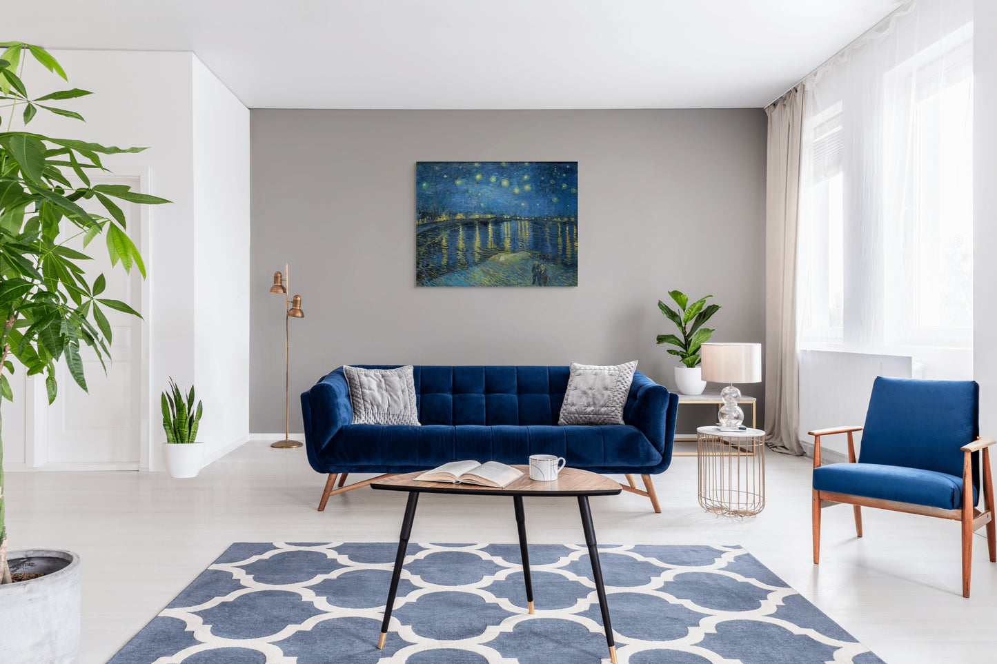 a living room filled with furniture and a painting on the wall