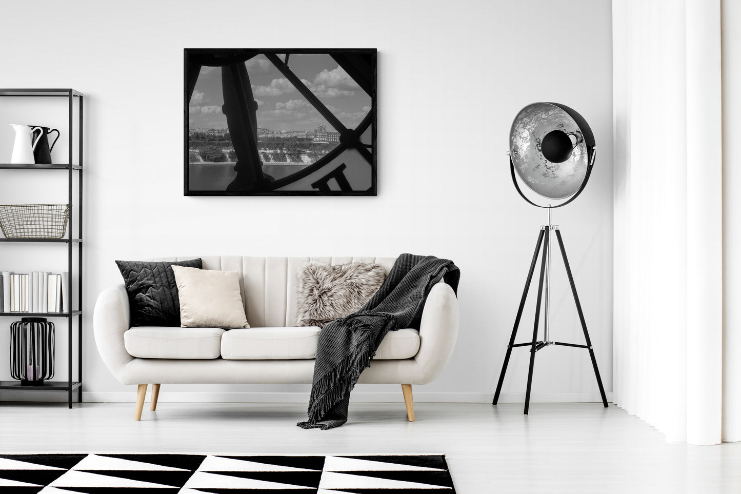 French Clock Canvas Wall Art in lounge room with white walls, cream lounge with several cushions, black blanket, black floor lamp and black checkered rug on a floating floorboard