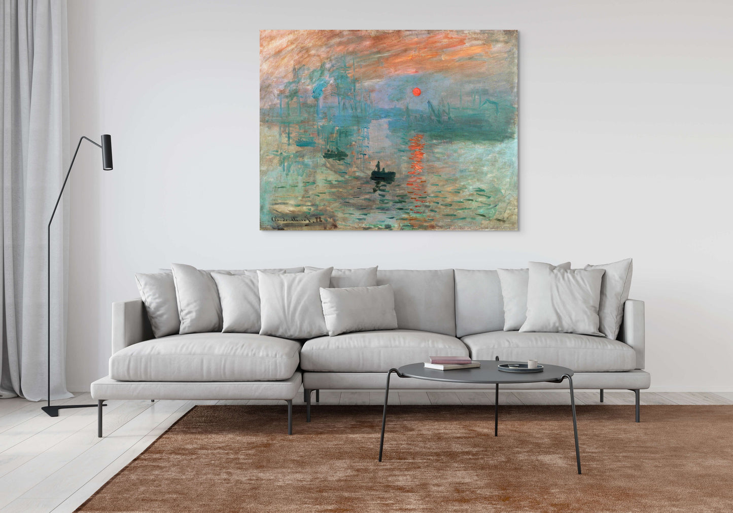 a living room with a couch and a painting on the wall