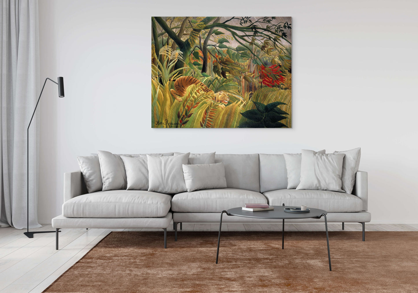 a living room with a couch and a painting on the wall