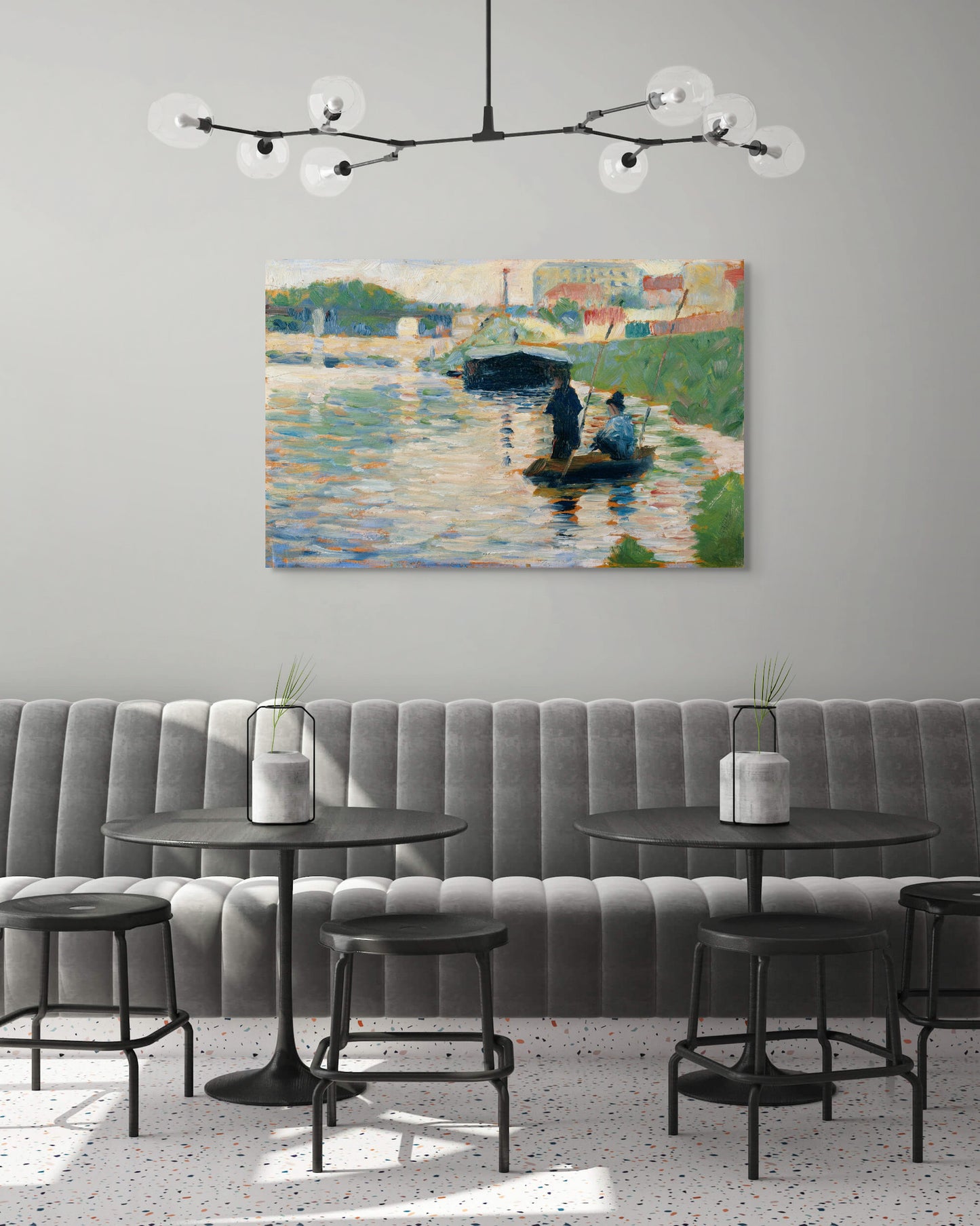a living room with a couch and a painting on the wall