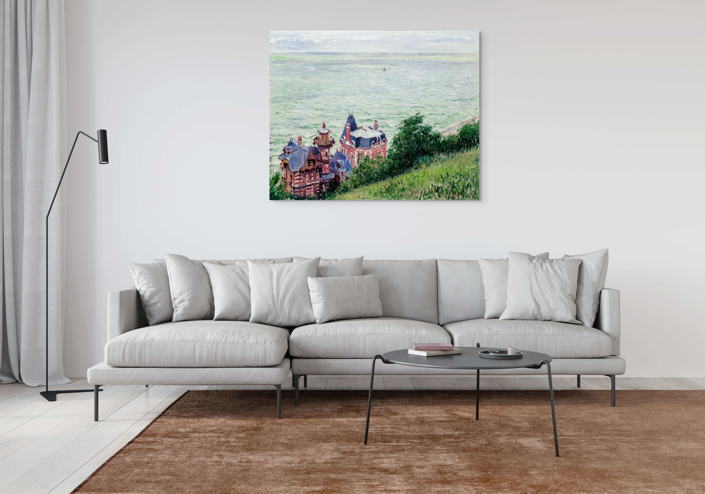 a living room with a couch and a painting on the wall