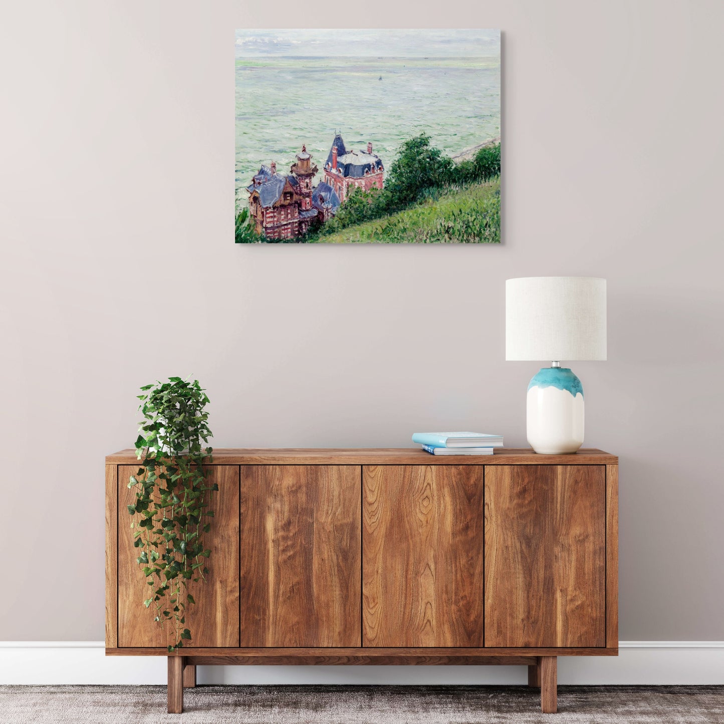 a painting on a wall above a wooden cabinet