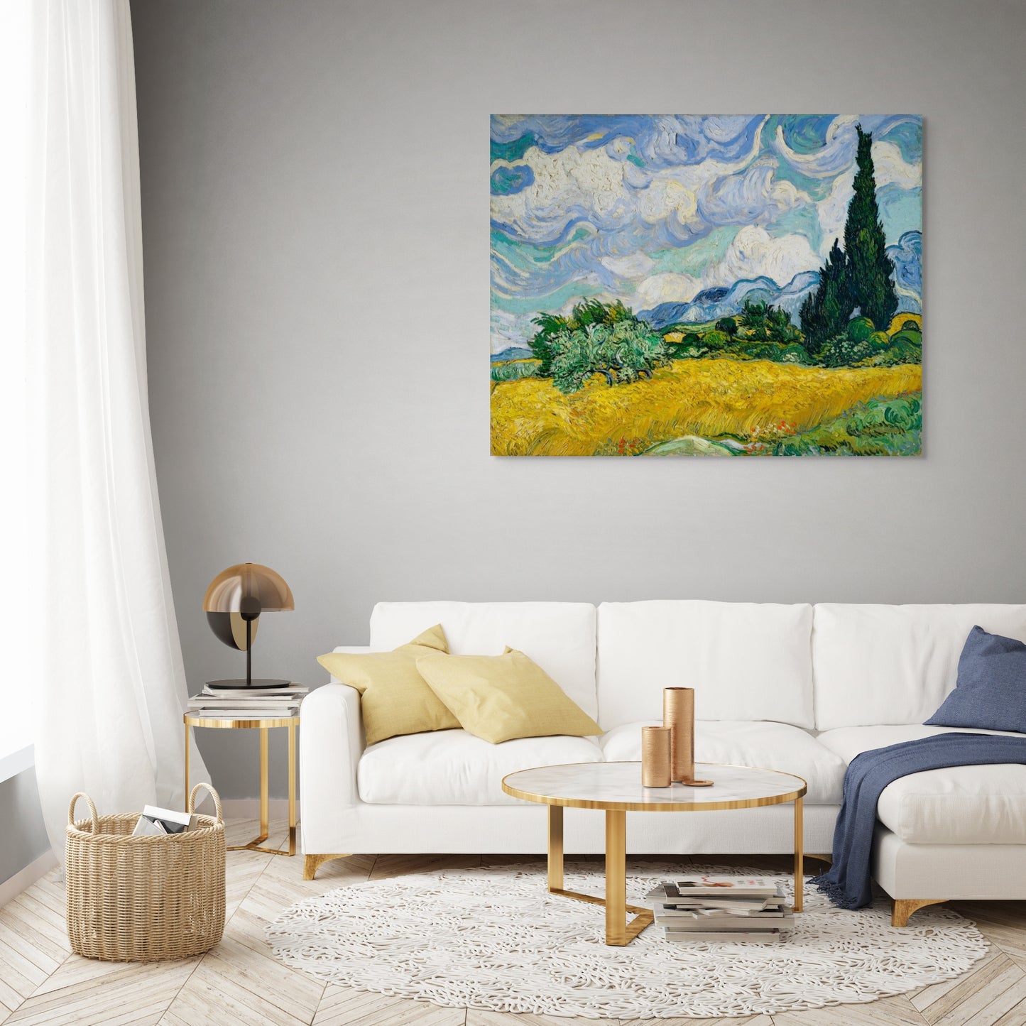 a living room with a white couch and a painting on the wall