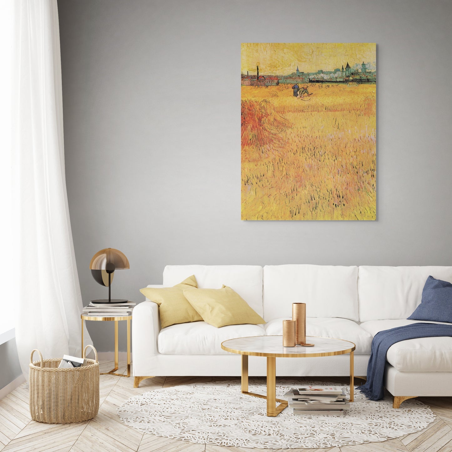 a living room with a white couch and a painting on the wall