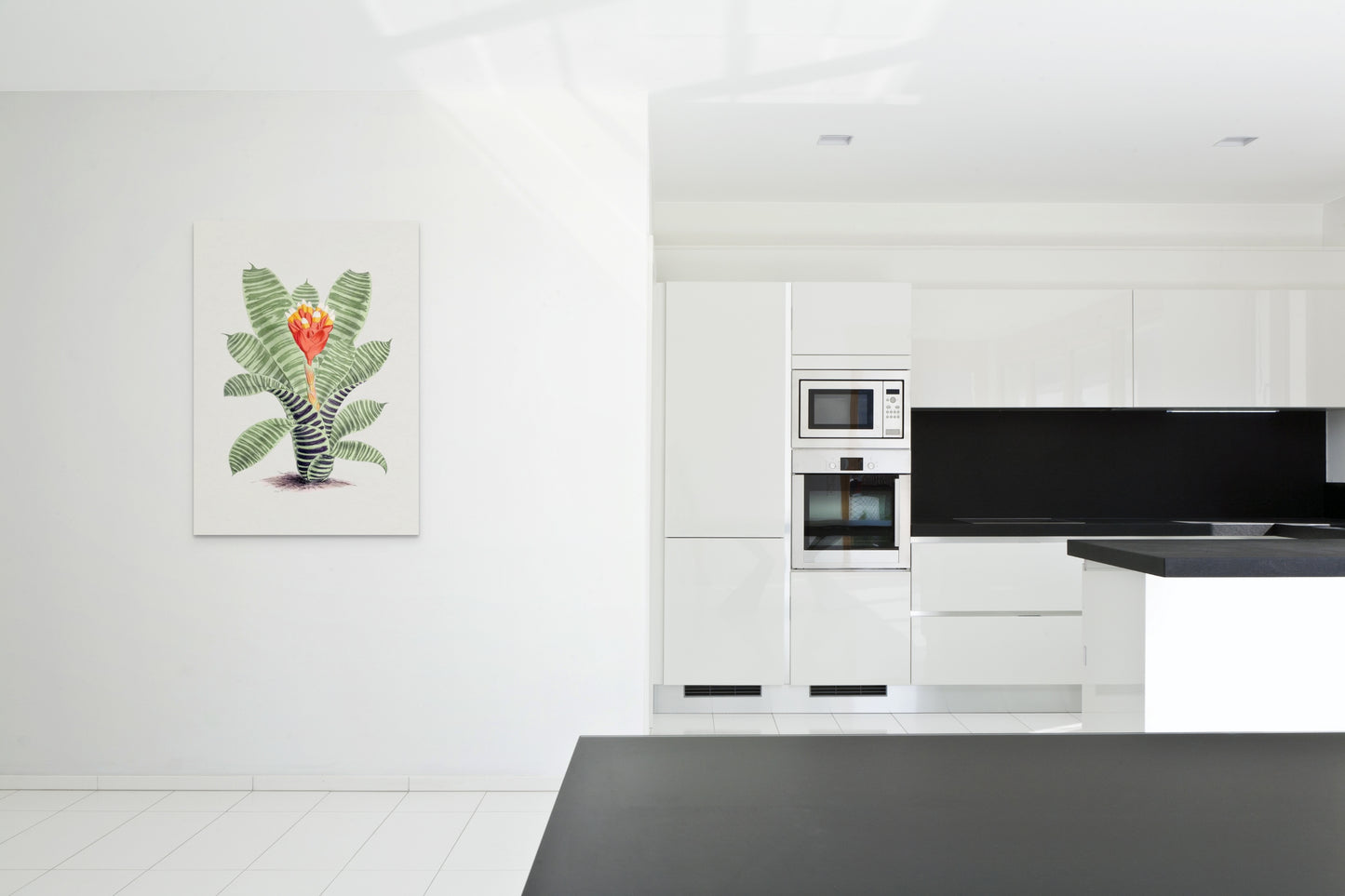 a kitchen with a black counter top and white cabinets