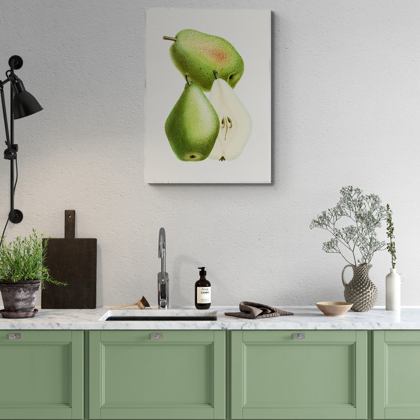 a kitchen with green cabinets and a painting on the wall