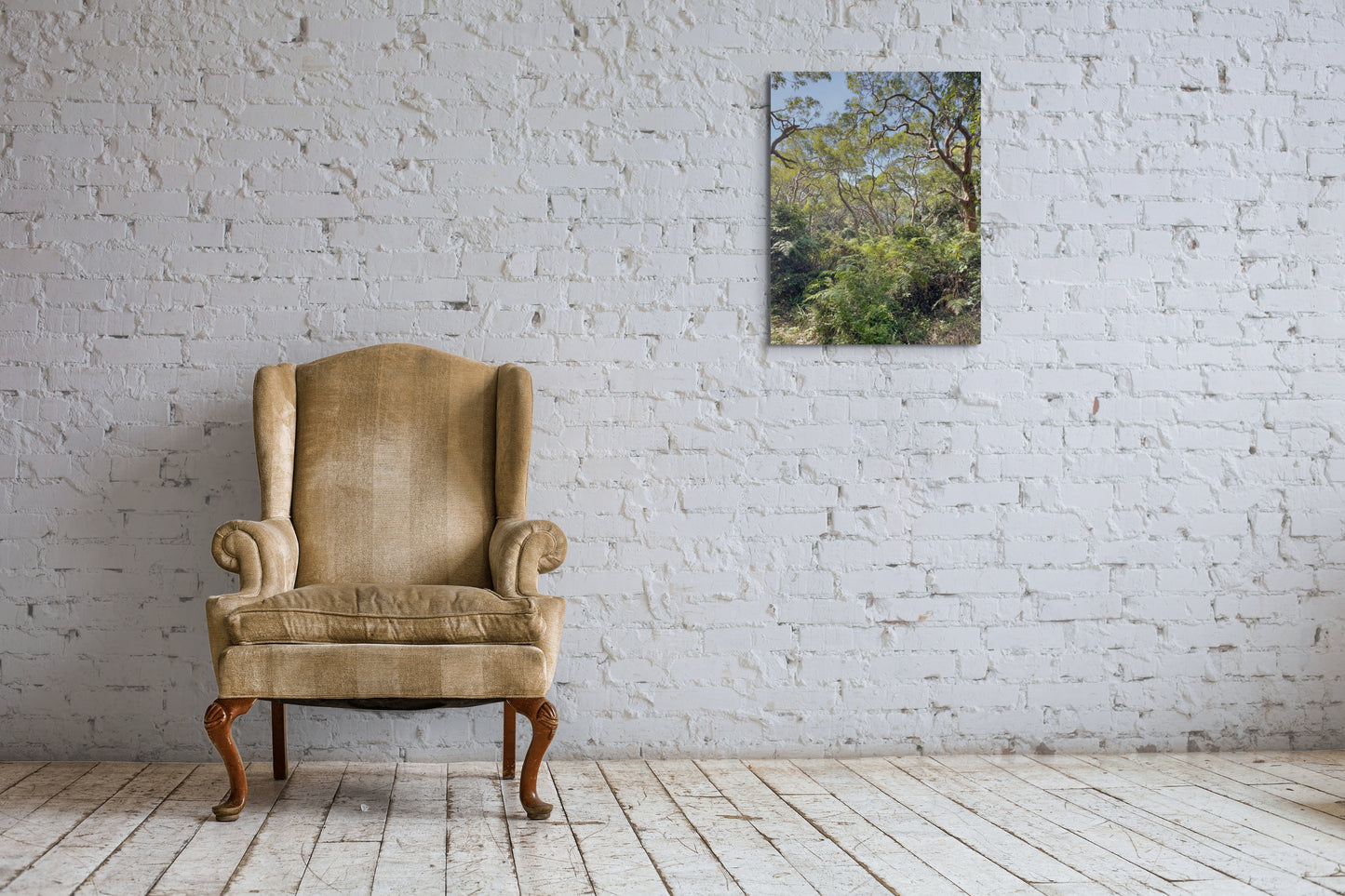 Rainforest Canvas Wall Art in lounge room with white brick wall, brown chair and white floorboards