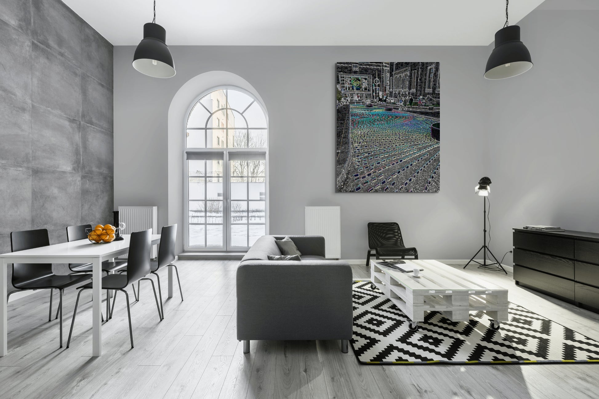 Neon Street Art Canvas Wall Art in loft style lounge room with grey walls, arch window, white table with four chairs, grey lounge, black pendant lights and a floor rug