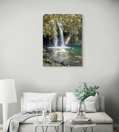 Waterfall Canvas Wall Art in loungeroom with grey wall, grey lounge, white floor lamp, two grey side tables, candles and wooden floorboards