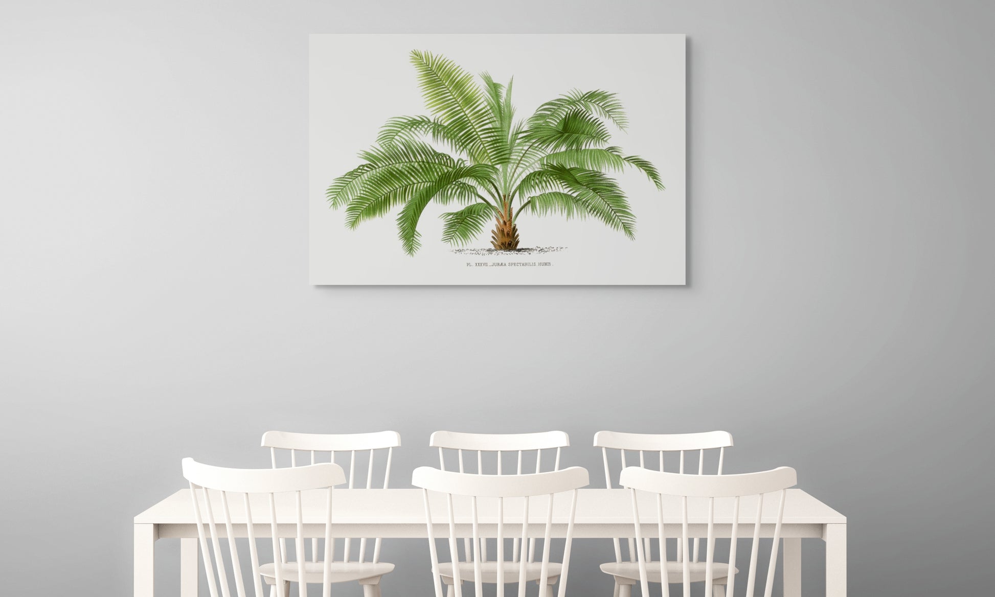 a dining room table with chairs and a painting of a palm tree on the wall