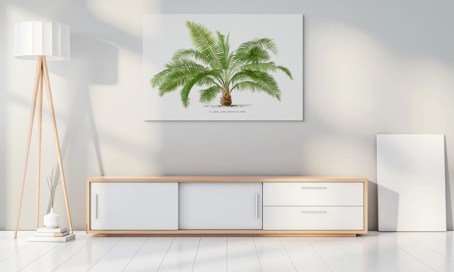 a living room with a white wall and a painting of a palm tree