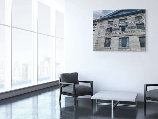 Old Warehouse Canvas Wall Art in office foyer with white wall, large windows, grey chairs, white side table and grey flooring
